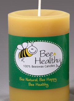 A 3"x6" Twisted Octagonal Pillar - White beeswax with the words bee healthy on it.