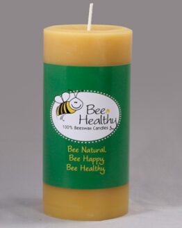 A 3"x6" Twisted Octagonal Pillar - White beeswax candle with the words "bee healthy" on it.