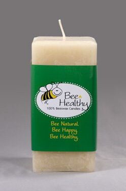 Bee Healthy beeswax candle with bee logo.