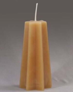 A tall, star-shaped, beeswax candle.