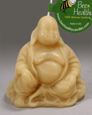 Beeswax candle of a laughing Buddha.