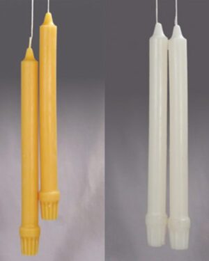 Two sets of tall, thin candles.