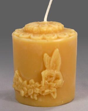 Yellow floral patterned candle with bunny