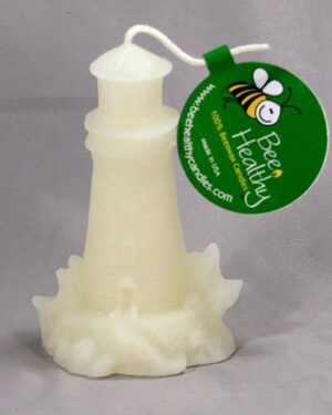 White lighthouse candle with bee design.