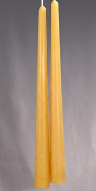 Two long, yellow beeswax candles.