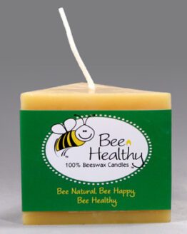 A 3"x6" Twisted Octagonal Pillar - White beeswax candle with a green label.