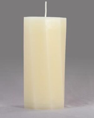 A tall, white, octagonal candle.