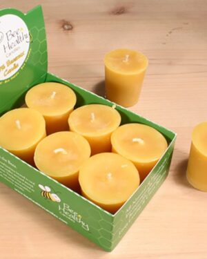 Beeswax candles in a green box.