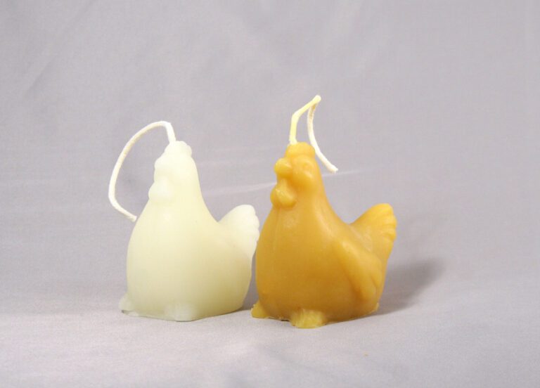 Two chicken shaped beeswax candles.