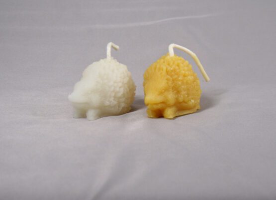 a pair of hedgehog candle gold beeswax