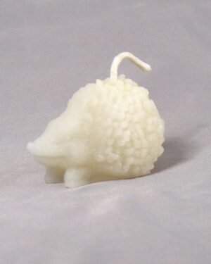 White hedgehog shaped candle with wick.