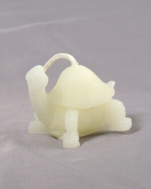 White wax turtle shaped candle.