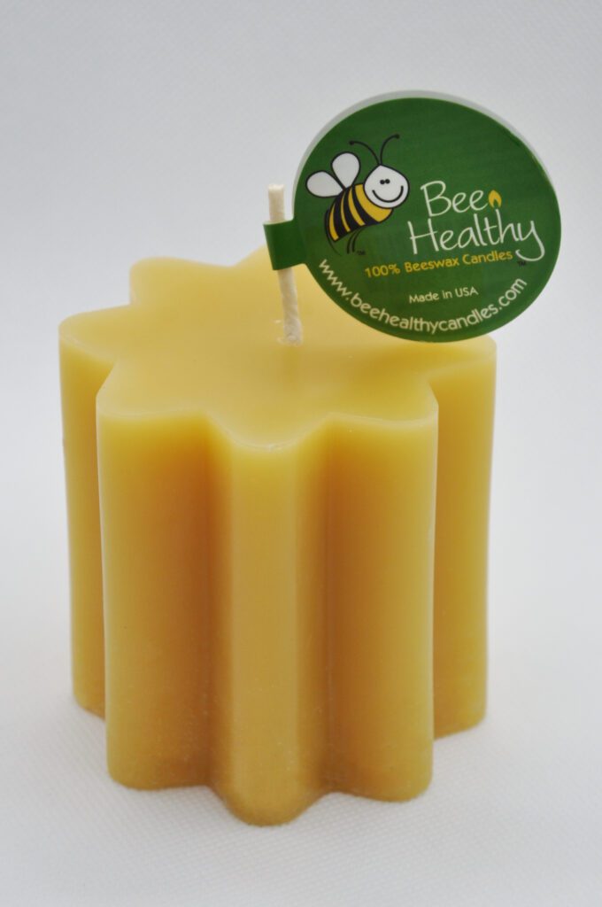 Star-shaped beeswax candle with a wick.