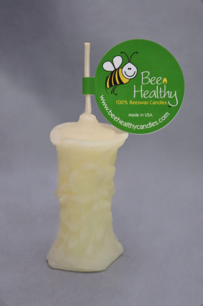 Beeswax candle with bee logo and label.