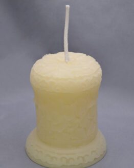 white sculpted pillar candle